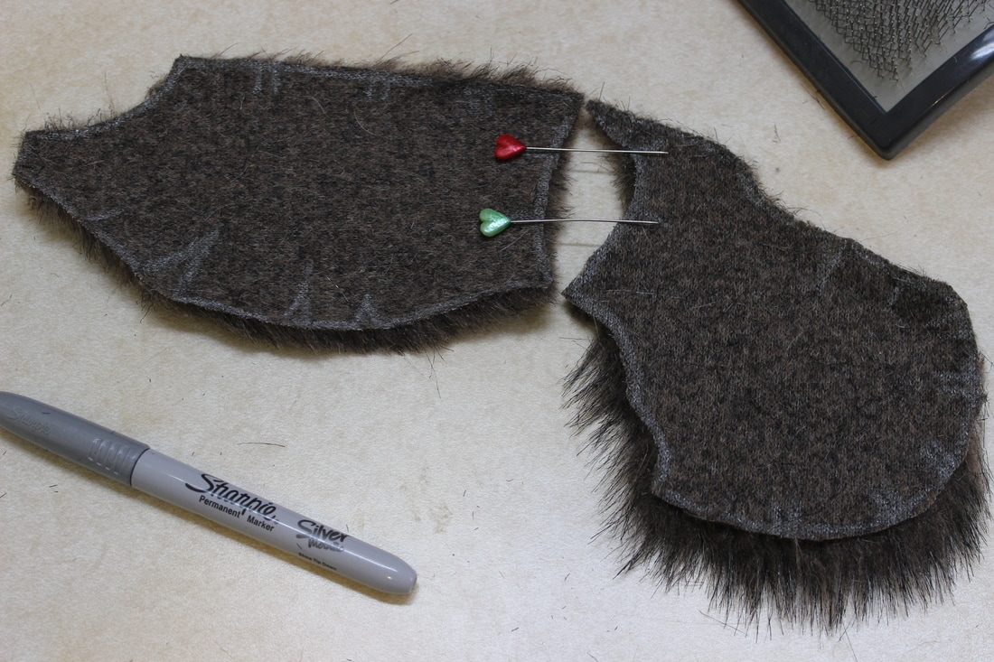 cheek and muzzle fur pieces with pins showing how they will be sewn together