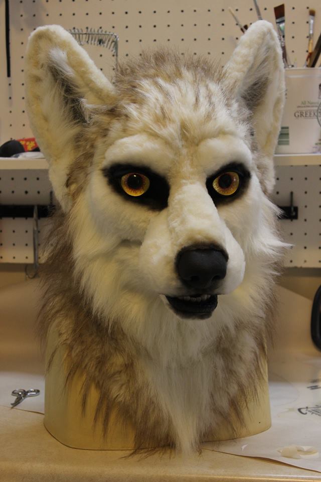 fursuit wolf head by sans souci studios with black paint airbrushed on