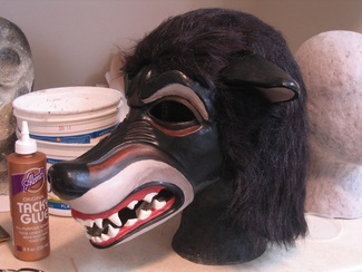 furry hood attached to wolf mask