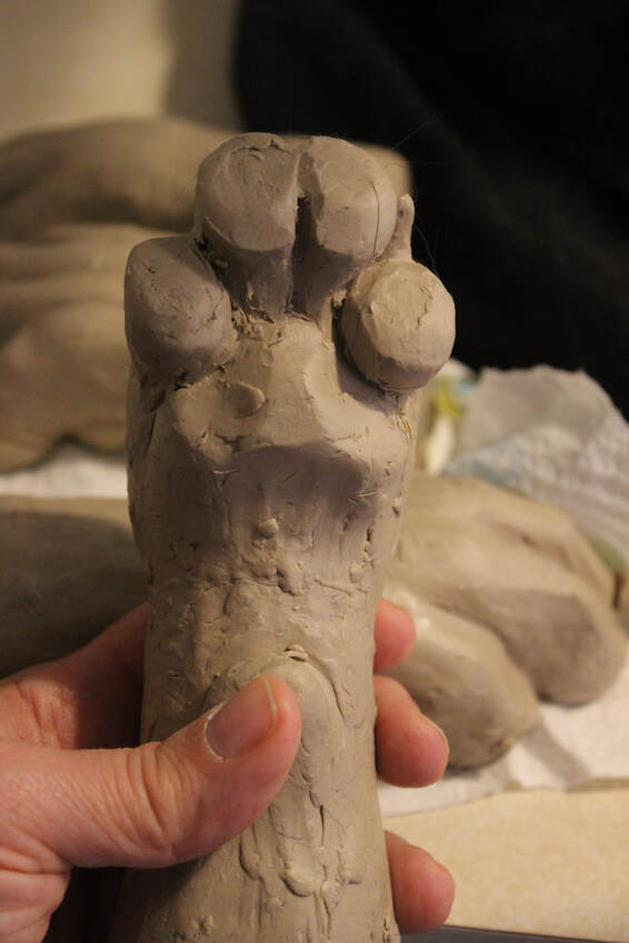 clay model for a fursuit handpaw