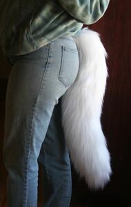 white fursuit wolf tail