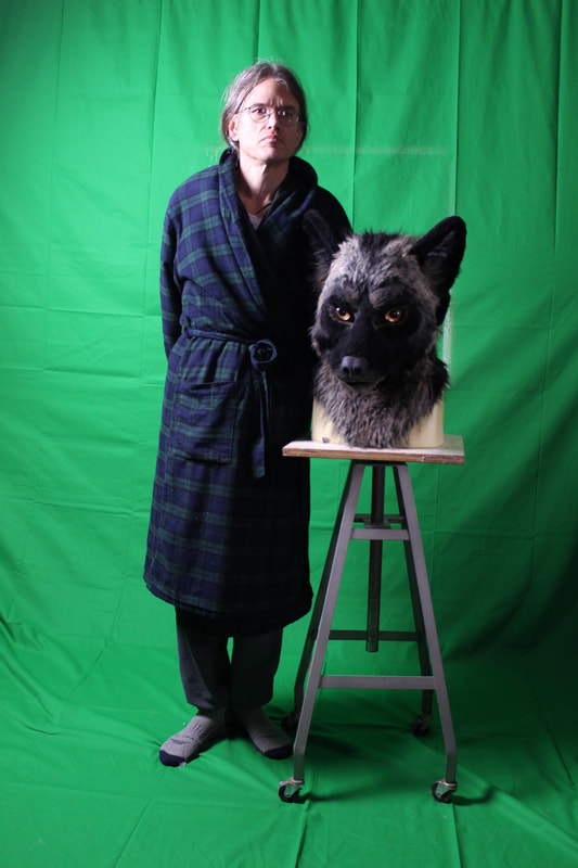 green screen setup with wolf fursuit head 