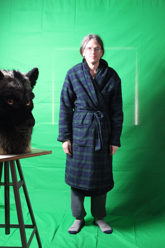 green screen setup with fursuit wolf head