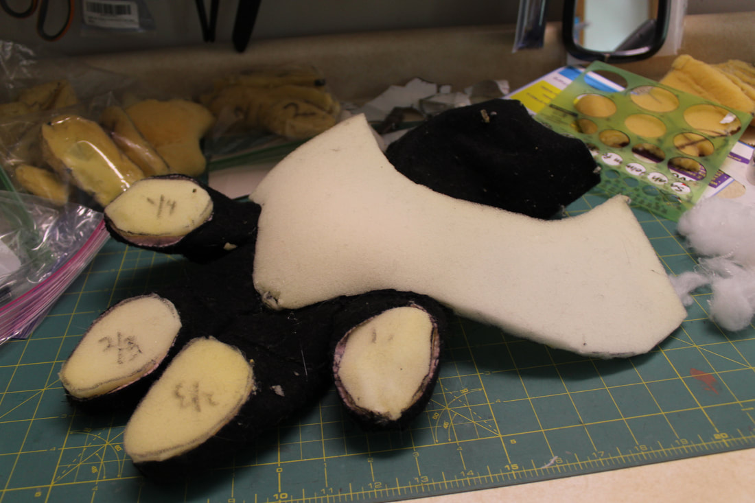 Foam supports inside feral handpaw canine fursuit